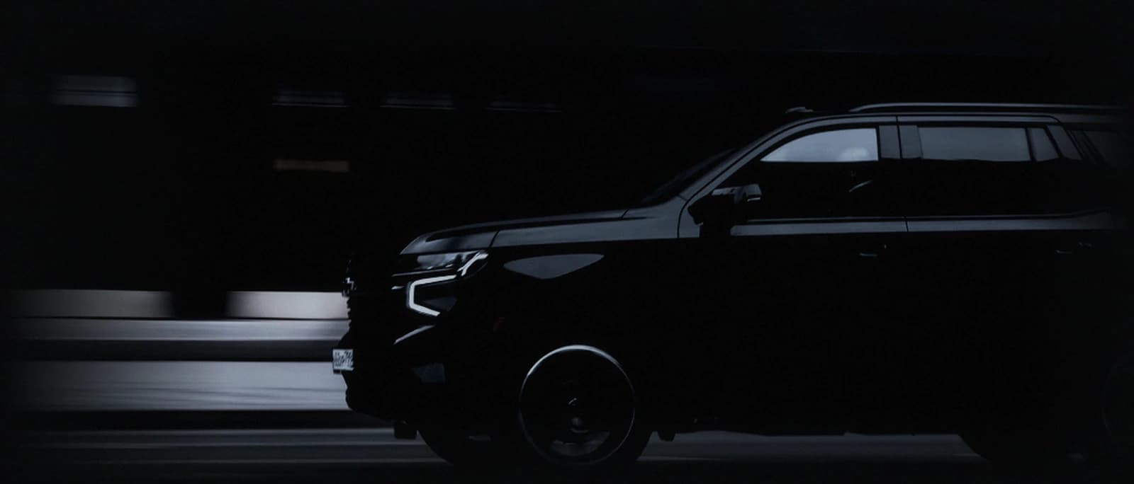 Armored SUV in motion on a city street