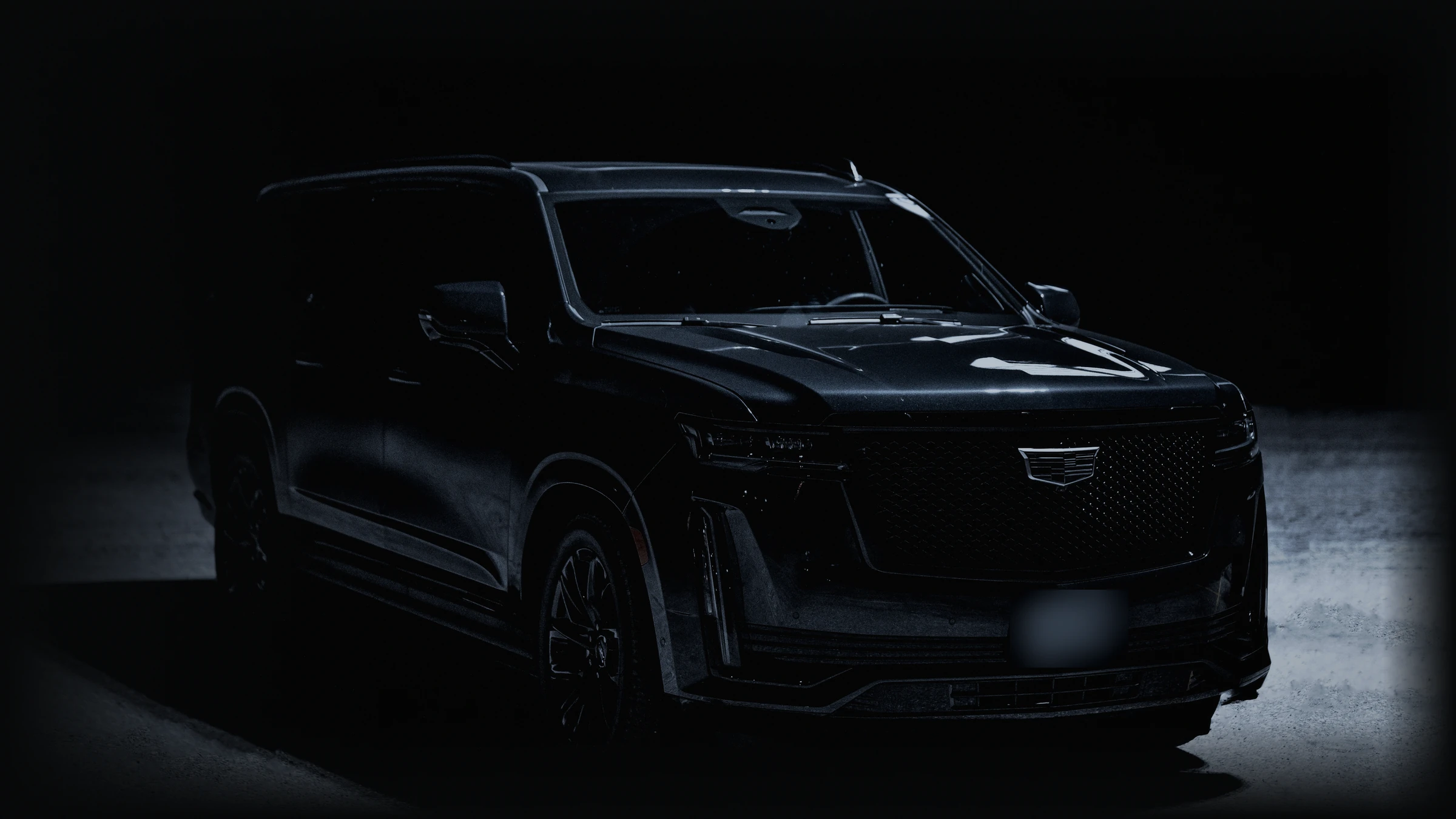 Armored Cadillac Escalade ESV at night